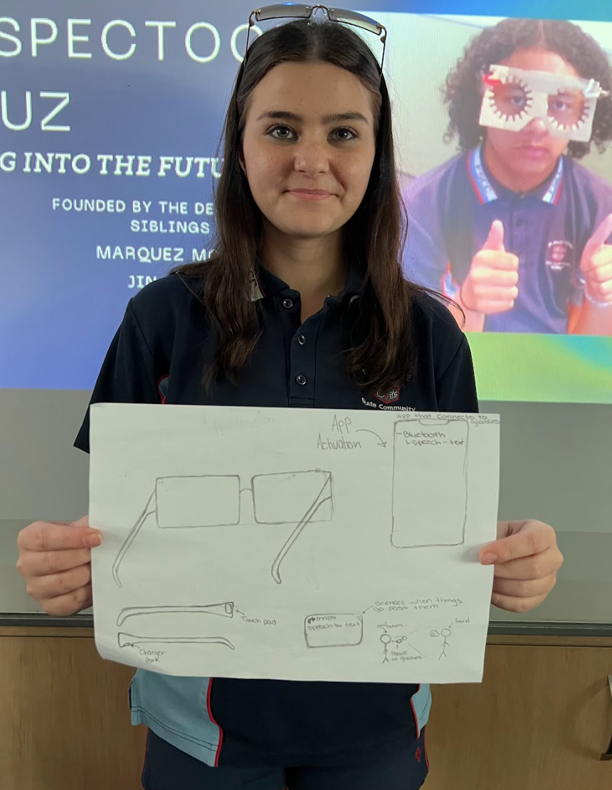 Girl holding pencil drawing of a prototype