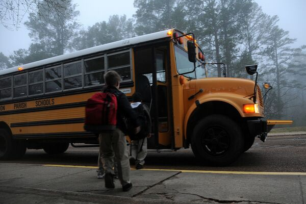 children boarding a yellow school bus