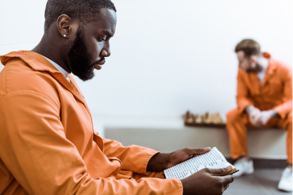 two men in prison uniform