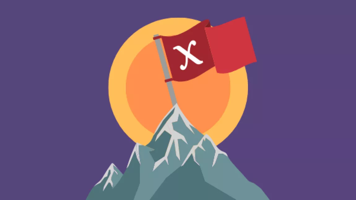 a flag atop a mountain